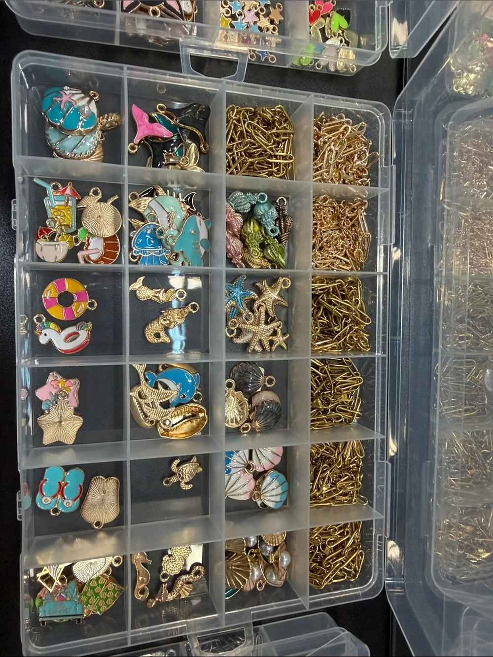 Charm necklace and bracelet making kit. Everything in the picture is included.